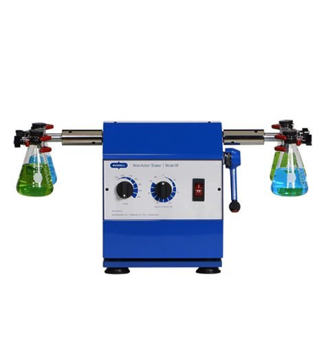 Sentwin wrist action shaker with clamped tube holders on a pivoting arm.